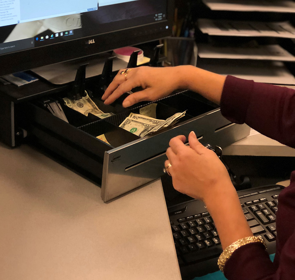 Photo of a cahier taking payment