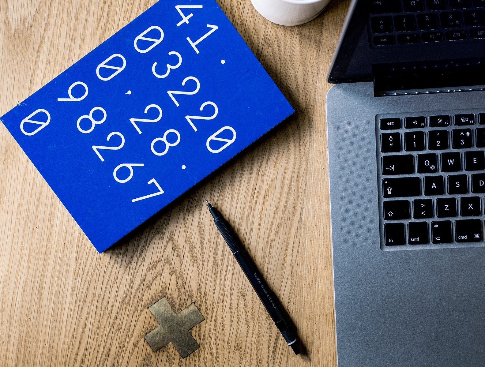 Photo of a laptop and calculator