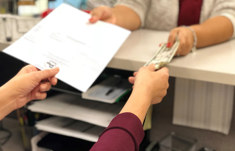 Photo of a cahier taking payment